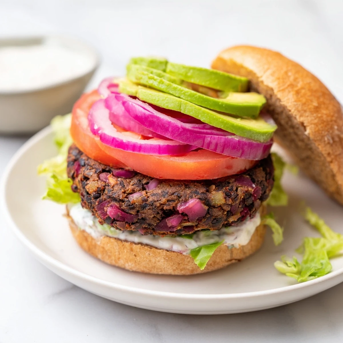 Enjoy these homemade Zesty Black Bean Burgers: a satisfying, vegetarian meal with fresh toppings.