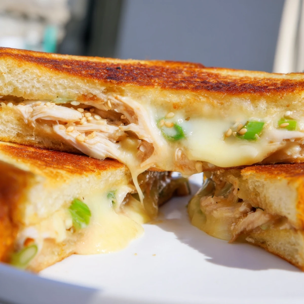 Golden, gooey Korean BBQ Chicken Wrap Grilled Cheese, bursting with savory flavors and melting cheese.