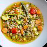 Hearty Simple Homemade Grain and Vegetable Soup displayed in a rustic bowl, ready for a comforting meal.