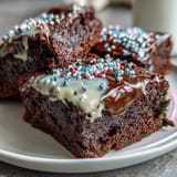 Red, white, and blue decorated Firecracker Brownie Bites, perfect for celebrating Independence Day with friends and family.