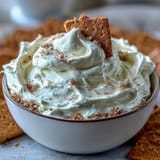 Viral 3-ingredient cheesecake dip, smooth and sweet, served chilled with crunchy graham cracker pieces.