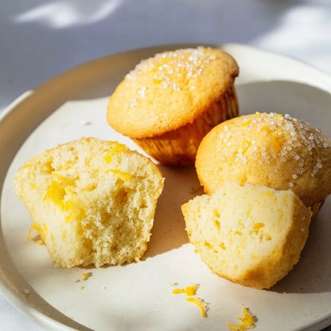 Golden Simple Sweet Lemon Zest Muffins, a perfect, fluffy treat with a delightful citrus aroma.