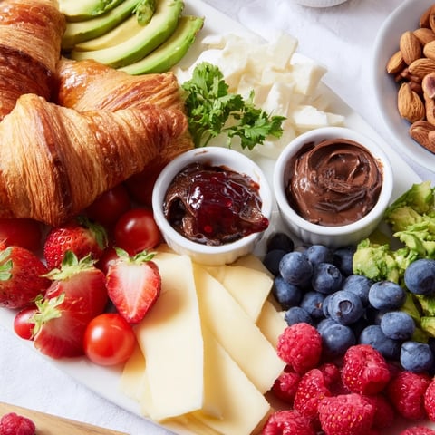 Warm, flaky croissants with a cozy fireplace croissant board, perfect for sharing and easy enjoyment.