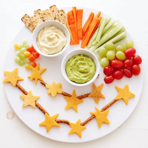 Kids Snack Adventure Map featuring colorful veggies, cheese shapes, and pretzel stick pathways leading to yummy dips.